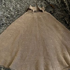 Tan Mini flare skirt with a brown belt for detail